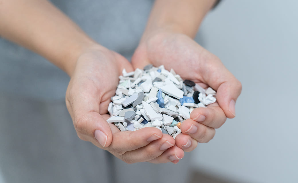 Recycled plastic material in hands